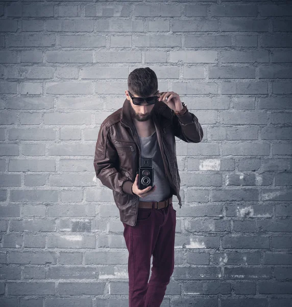 Fashion model in front of brick urban wall — Stock Photo, Image