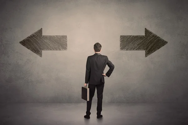 Business man taking a decision while standing in front of two gr — Stock Photo, Image