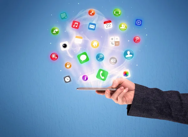 Hand holding tablet phone with app icons — Stock Photo, Image