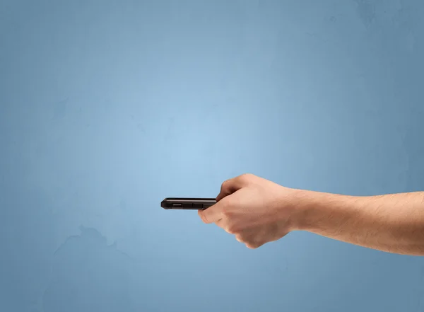 Holding telephone device from profile — Stock Photo, Image