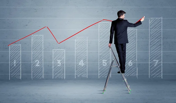 Man drawing chart from ladder — Stock Photo, Image