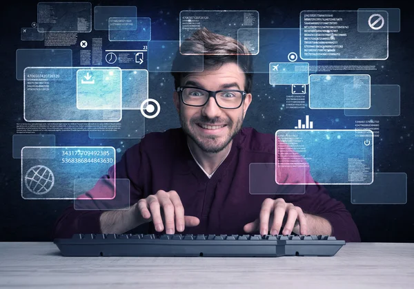 Nerd with glasses hacking websites — Stock Photo, Image