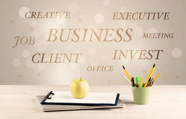 Business office desk with writing on wall — Stock Photo, Image