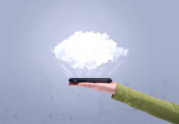 Hand holding phone with empty cloud — Stock Photo, Image