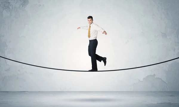 Sales guy balancing on tight rope — Stock Photo, Image