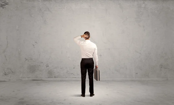 Businessman lost in empty urban space — Stock Photo, Image