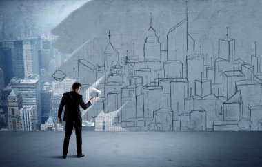 Zarif satıcı şehri duvarda yeniden boyuyor.