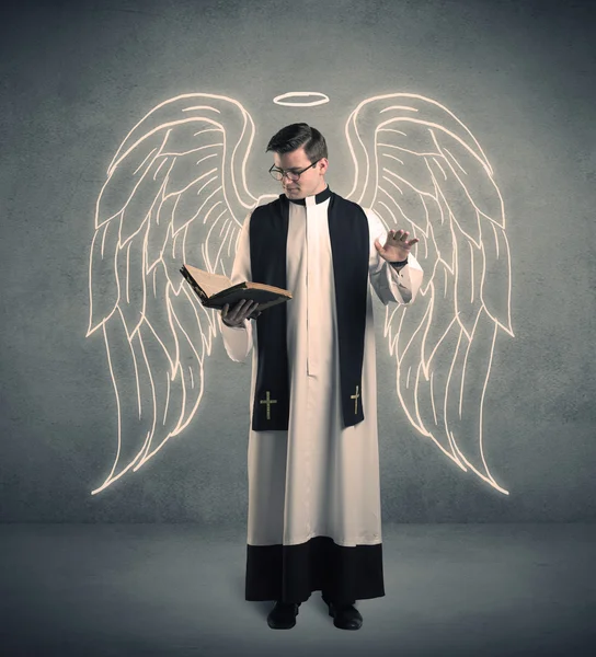 Young priest in giving his blessing — Stock Photo, Image