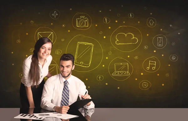 Business couple with media icons background — Stock Photo, Image