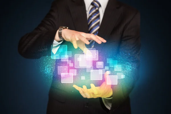 Man holding abstract icons — Stock Photo, Image