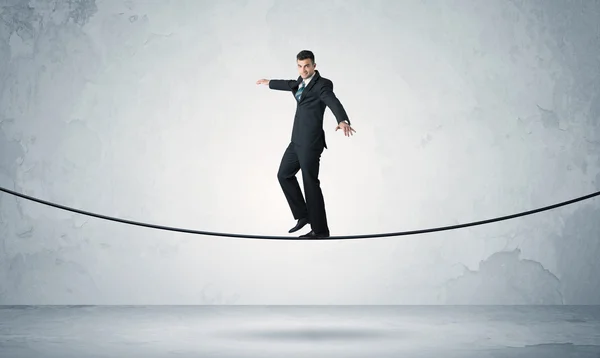 Sales guy balancing on tight rope — Stock Photo, Image