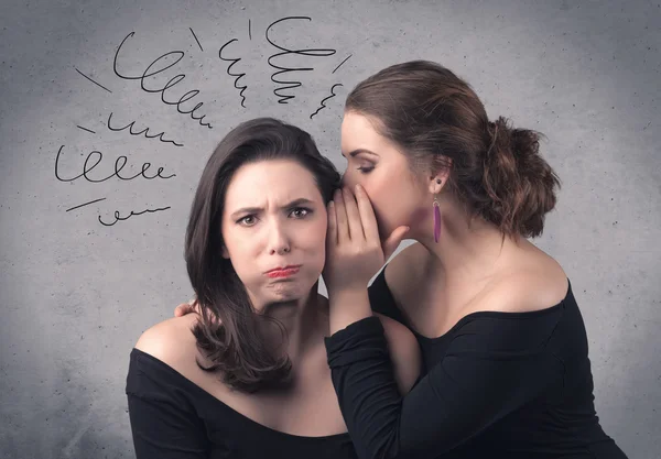 Girl telling secret things to her girlfriend — Stock Photo, Image