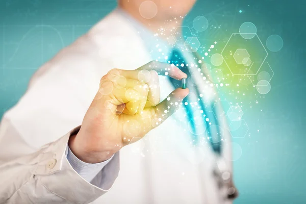 A doctor in tie holding a pill — Stock Photo, Image