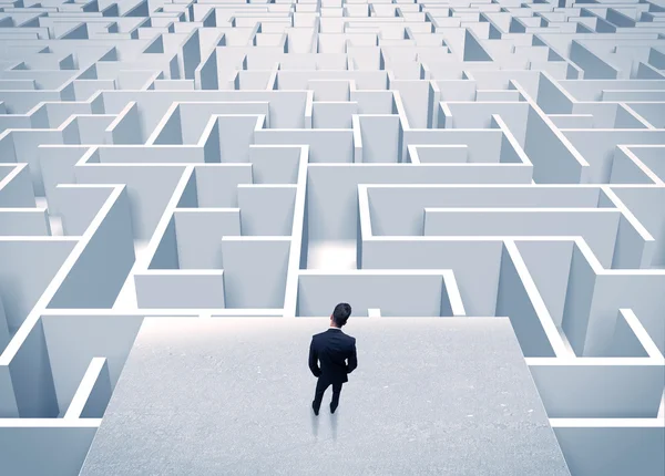 Businessman staring at infinite maze — Stock Photo, Image