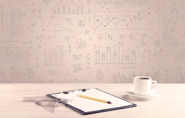 Graph charts and designer office desk — Stock Photo, Image