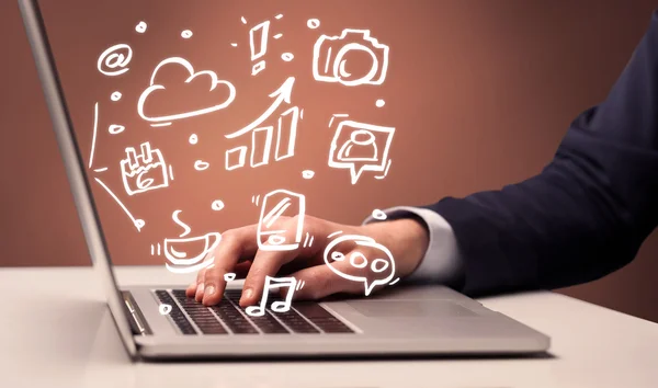 Office worker sitting in front of laptop — Stock Photo, Image