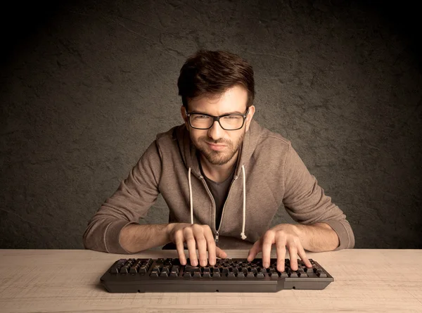 Computer geek typing on keyboard — Stock Photo, Image