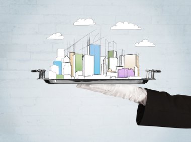 Şehre el ve tepside bulutlar