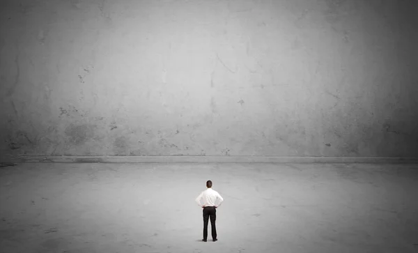 Small business person in large empty space — Stock Photo, Image