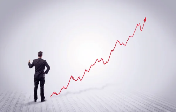 Állandó üzletember, a piros grafikon nyíl — Stock Fotó