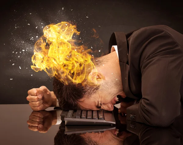 Stressed business man's head is burning — Stock Photo, Image