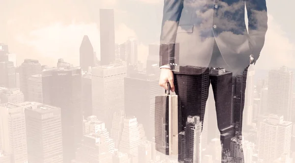 Handsome business man with overlay cityscape — Stock Photo, Image