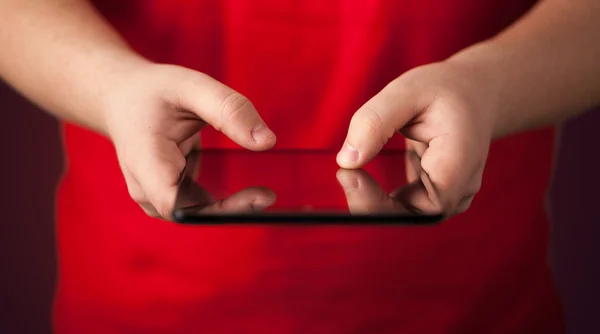 Close up of hand holding digital touchpad tablet device — Stock Photo, Image