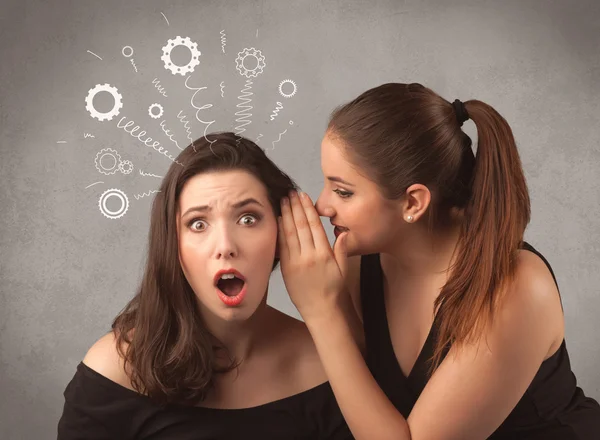 Girl telling secret things to her girlfriend — Stock Photo, Image