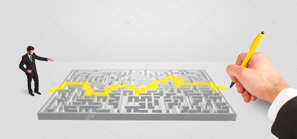 Businessman in front of a maze with solution