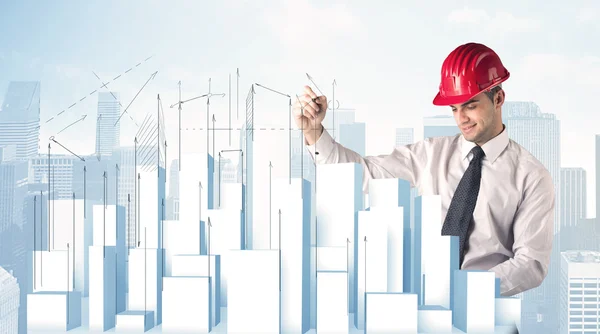 Businessman drawing skyscrapers — Stock Photo, Image