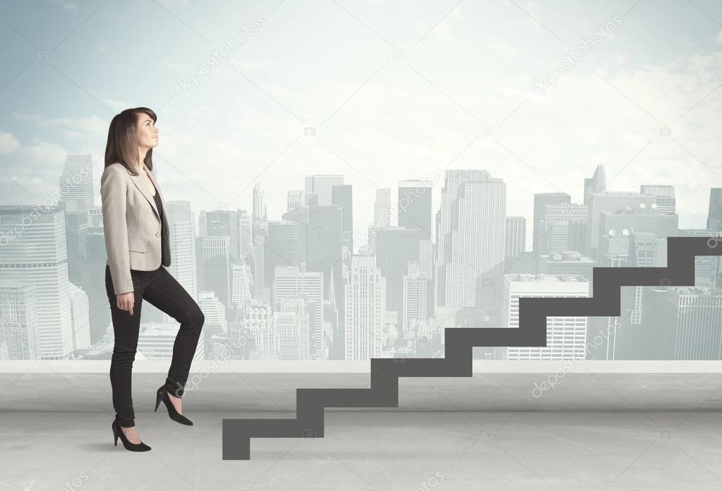 Business person in front of a staircase