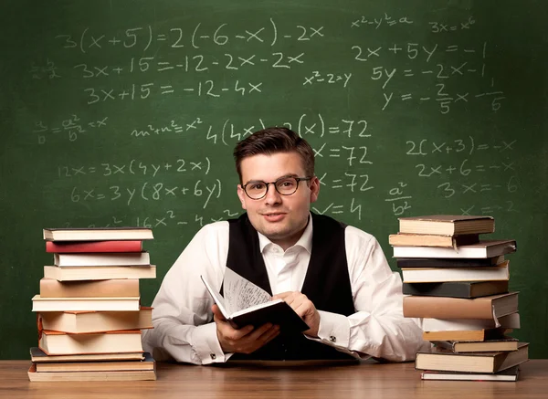 Math teacher at desk — Stock Photo, Image