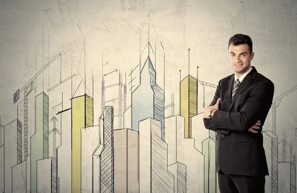 Biznesmen stojący z narysowanym krajobrazem miasta — Zdjęcie stockowe