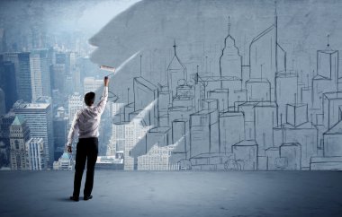 Zarif satıcı şehri duvarda yeniden boyuyor.