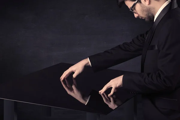 Close up of a hand touching smart table with copy space — Stock Photo, Image