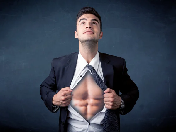 Businessman tearing off shirt and showing mucular body — Stock Photo, Image