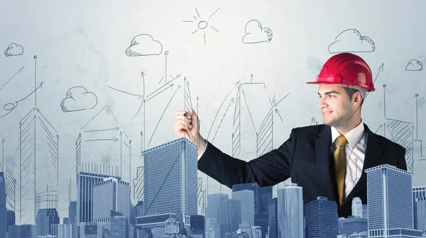 Young worker drawing a city sight — Stock Photo, Image