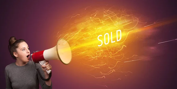 Young girld shouting in megaphone — Stock Photo, Image