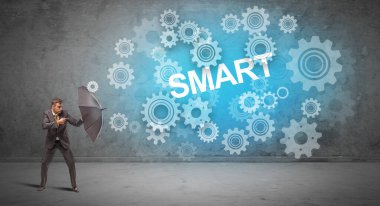 Şemsiyeyle savunma yapan iş adamı