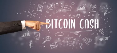 İşletme yazıtlarına işaret eden kırpılmış elin yakın çekimi