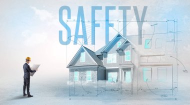 Planı elinde tutan genç mühendis.