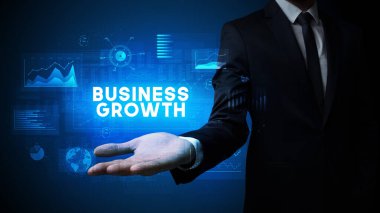 Motivasyon mesajı taşıyan iş adamının eli