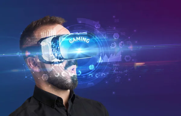 Businessman looking through VR glasses — Stock Photo, Image