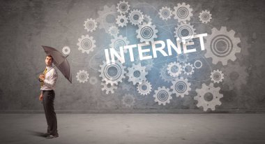 Şemsiyeyle savunma yapan iş adamı