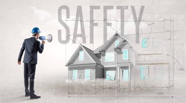 Planı elinde tutan genç mühendis.