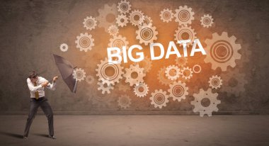 Şemsiyeyle savunma yapan iş adamı