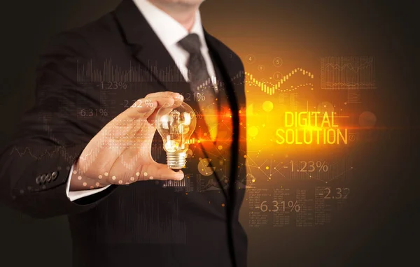 Businessman holding a lightbulb concept — Stockfoto