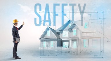 Genç mühendis proje konseptini elinde tutuyor