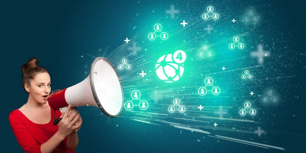 Young person with megaphone and social networking icon — Stock Photo, Image