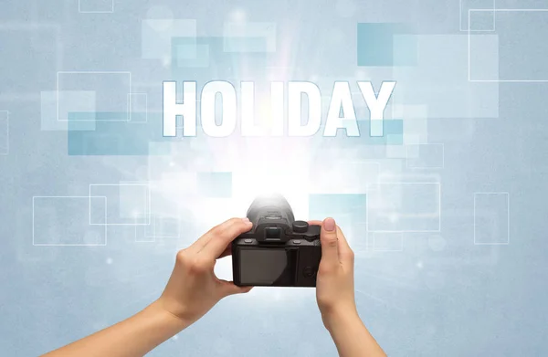 Hand holding digital camera, traveling concept — Stock Photo, Image